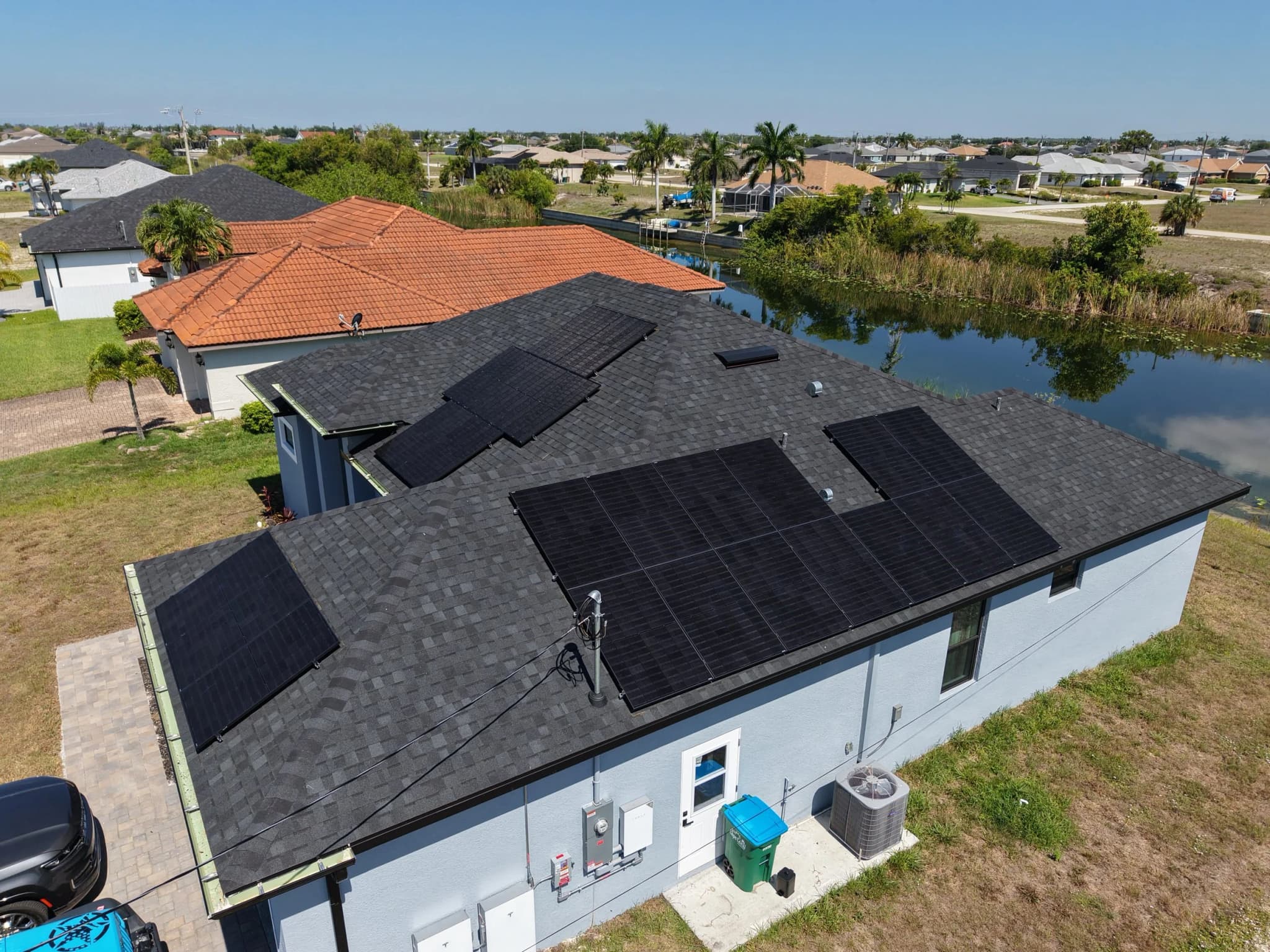 Aerial view of a Southwest Florida canal home with a pool
