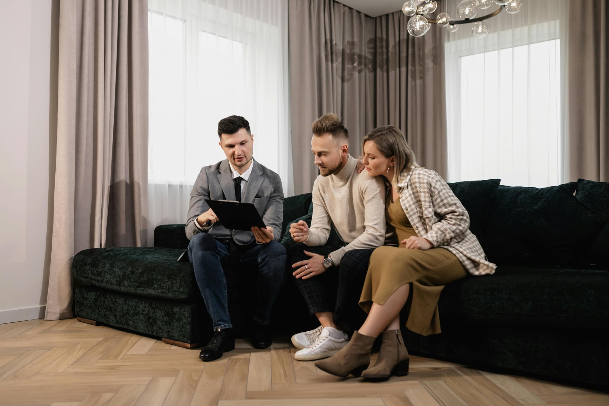 An energy advisor meeting with homeowners at their kitchen table