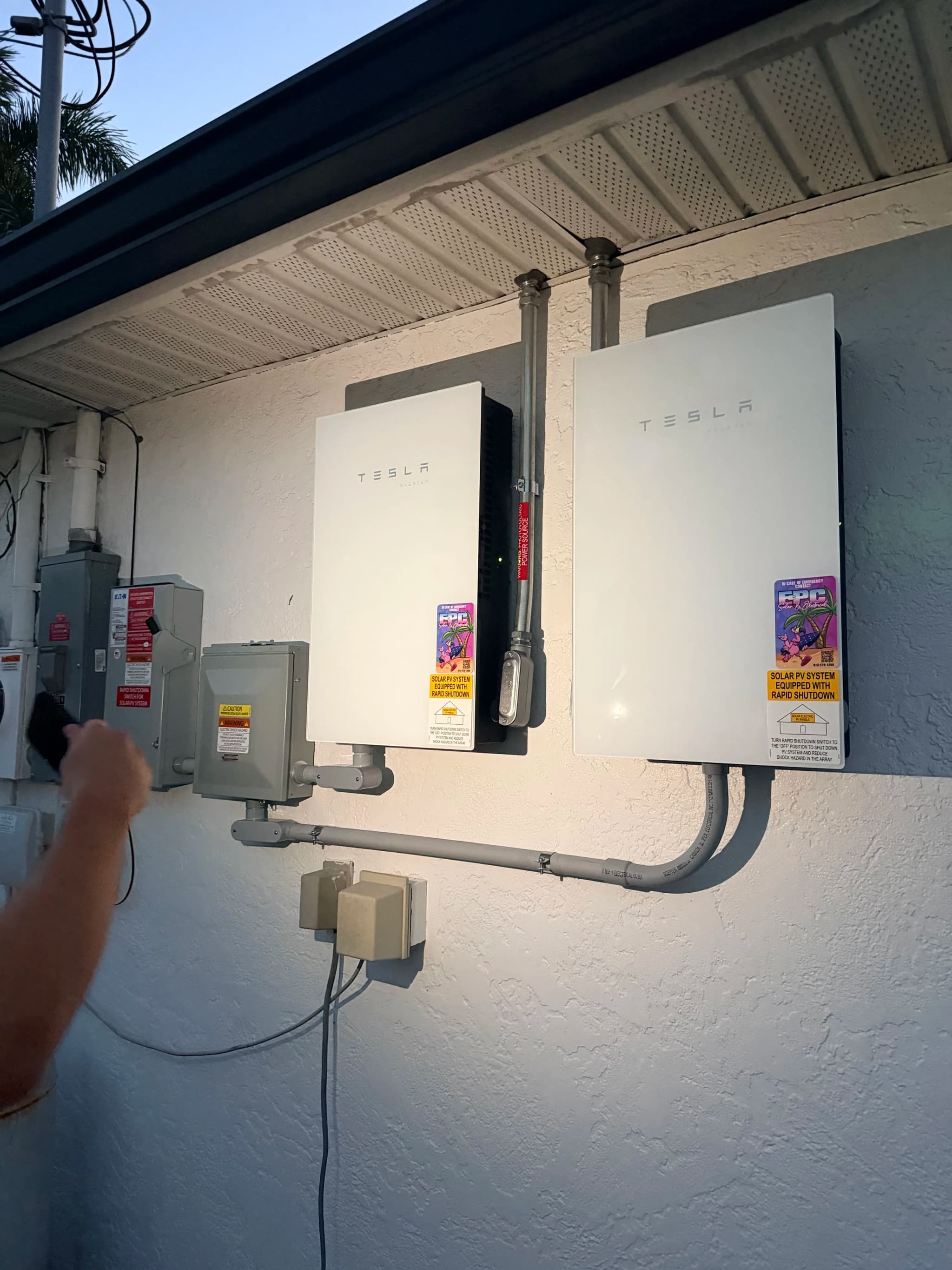 Installation crew mounting solar panels on a residential roof